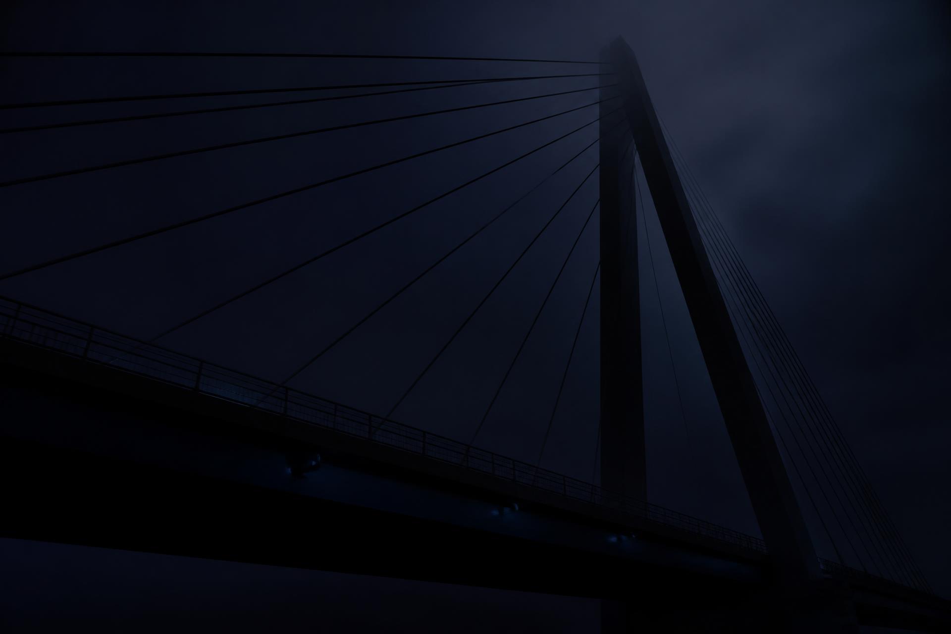 Abstract suspension bridge at night